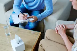 NDIS support worker providing in-home counselling and behaviour therapy for a child in Pimpama.